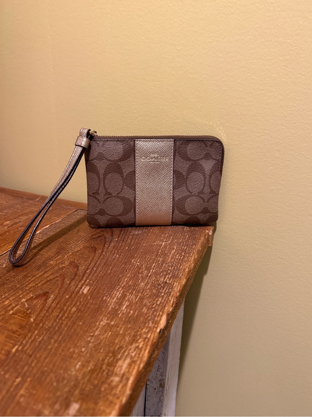 Coach Brown Signature Wristlet with Metallic Center Stripe